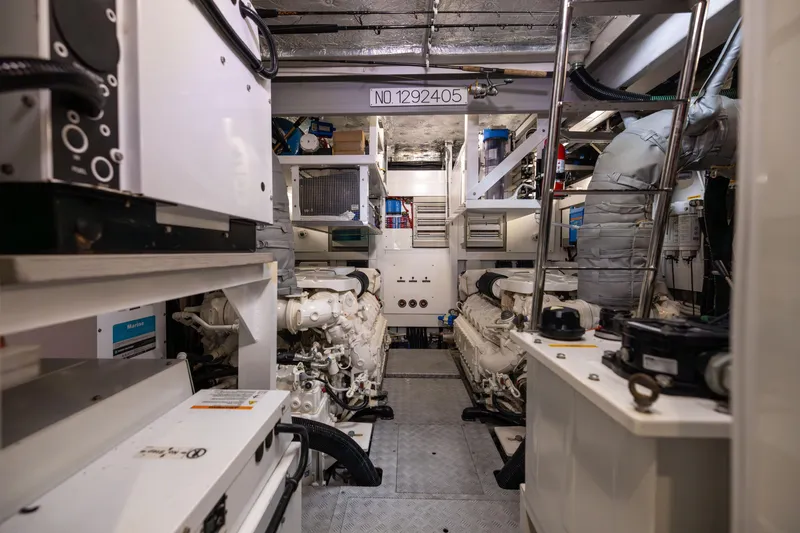 Slide: The Image of Engine room of a 2019 Sunseeker 76 yacht, showcasing machinery and equipment. - 140