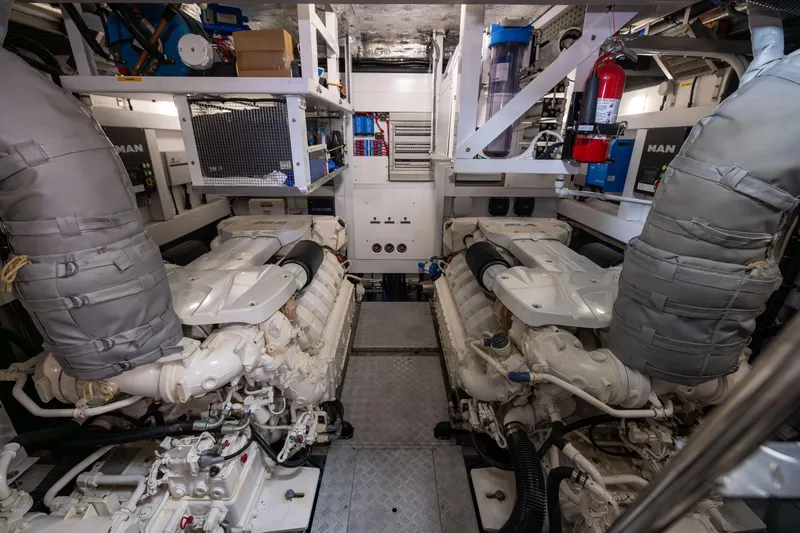 Slide: The Image of Engine room of 2019 Sunseeker 76 yacht, featuring dual MAN engines and equipment. - 143