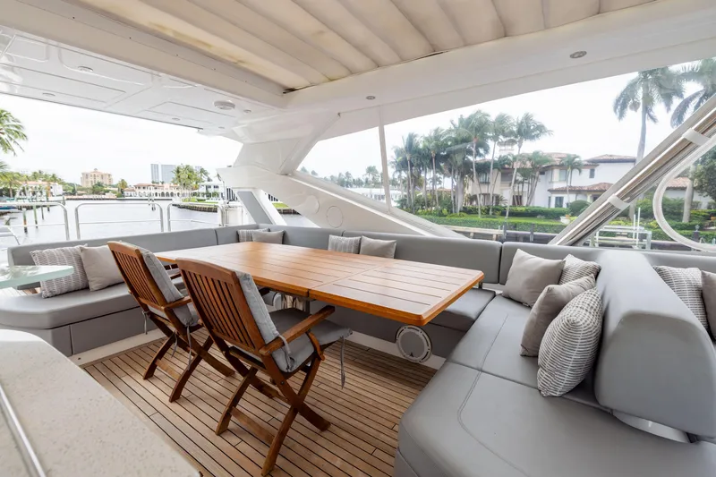 Slide: The Image of Luxurious Sunseeker 76 yacht deck with elegant seating and dining area, 2019 model. - 21