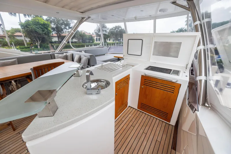 Slide: The Image of Luxurious Sunseeker 76 yacht interior with modern kitchen and seating area, 2019 model. - 23