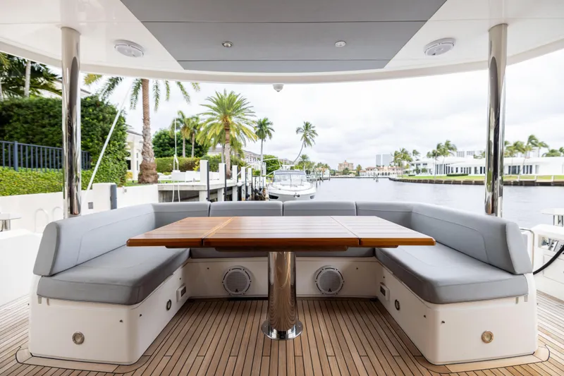 Slide: The Image of Luxurious Sunseeker 76 yacht deck with seating, table, and waterfront view, 2019 model. - 30