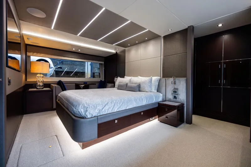 Slide: The Image of Luxurious bedroom interior of 2019 Sunseeker 76 yacht with modern design and ambient lighting. - 98