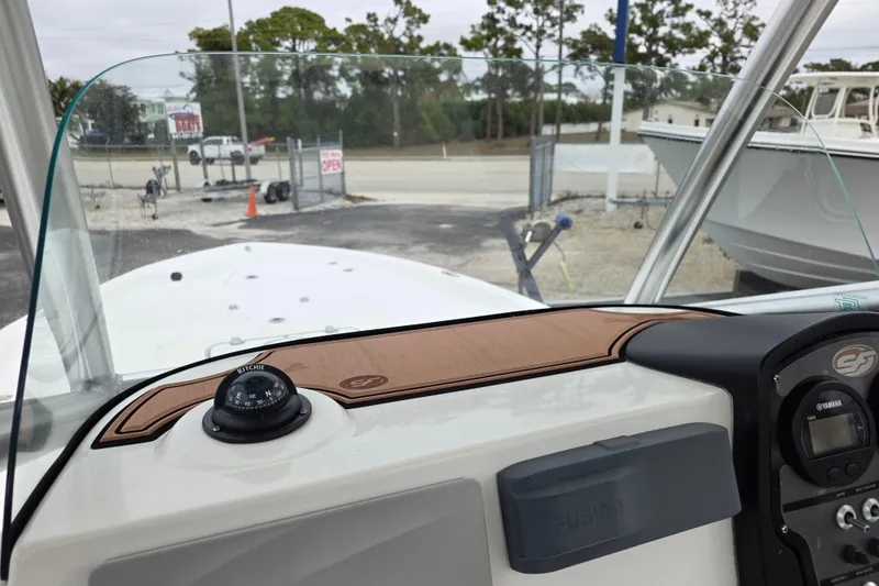 Slide: The Image of 2016 Sea Fox 22XTR Viper boat dashboard with compass and controls. - 14
