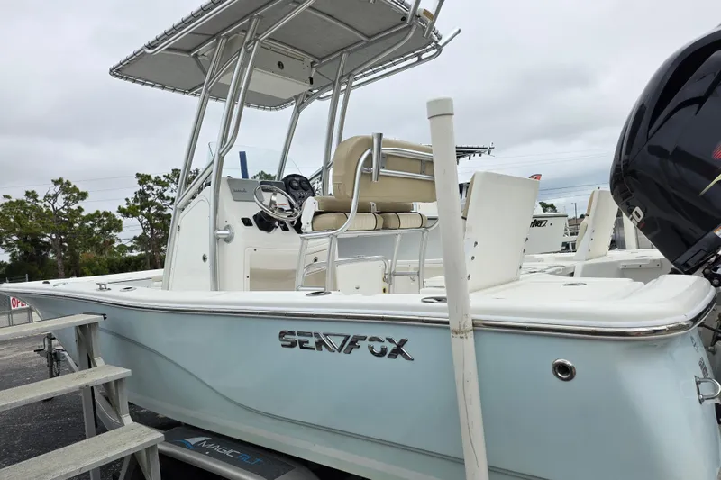 Slide: The Image of 2016 Sea Fox 22XTR Viper boat with T-top and outboard motor, parked on trailer. - 21