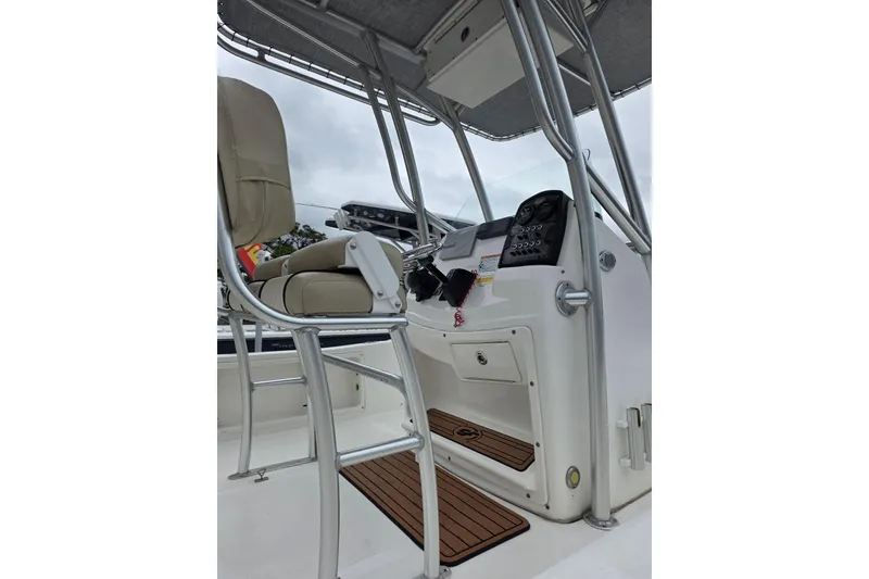 Slide: The Image of 2016 Sea Fox 22XTR Viper boat console with seating and controls, featuring sleek design. - 6