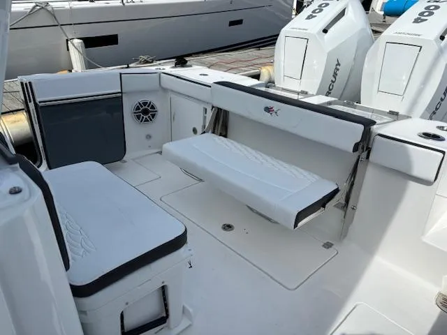 Slide: The Image of 2025 Crevalle 33 CTF boat interior with seating and Mercury engines. - 14