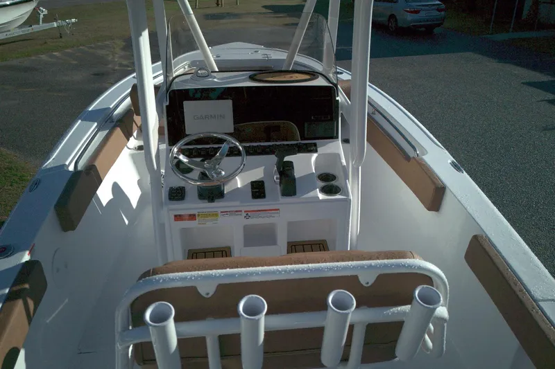 Slide: The Image of 2026 Sea Hunt Ultra 229 boat cockpit with Garmin navigation system and steering wheel. - 6