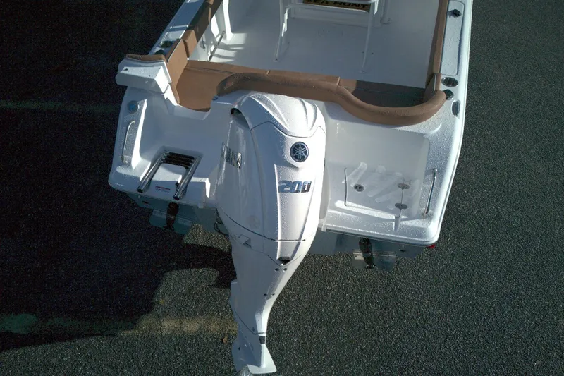 Slide: The Image of 2026 Sea Hunt Ultra 229 boat with Yamaha 200 outboard motor, rear view. - 7