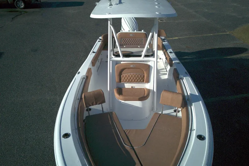Slide: The Image of 2026 Sea Hunt Ultra 229 boat with brown seating and white deck, viewed from above. - 8