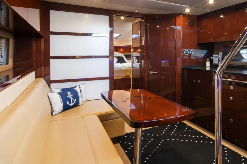 Slide: The Image of Luxurious interior of 2010 Sea Ray Sundancer yacht with elegant seating and polished wood finishes. - 30
