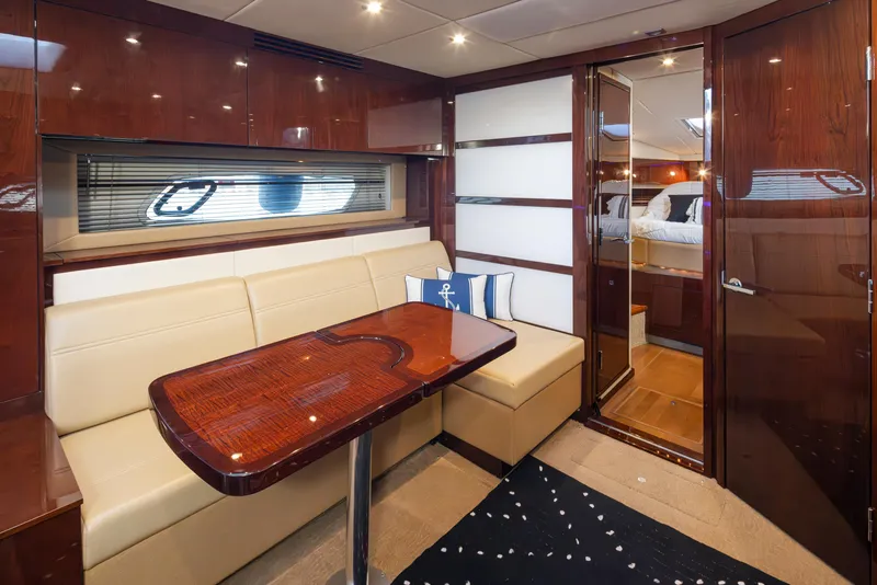 Slide: The Image of Luxurious interior of 2010 Sea Ray Sundancer yacht with elegant seating and wooden finishes. - 31