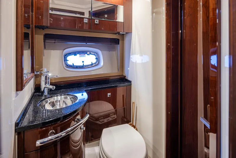 Slide: The Image of Luxurious bathroom in 2010 Sea Ray Sundancer yacht with sleek wood finishes and modern fixtures. - 43