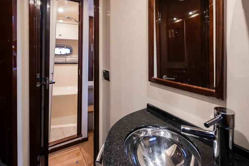Slide: The Image of Luxurious bathroom interior of 2010 Sea Ray Sundancer yacht with modern sink and mirror. - 44