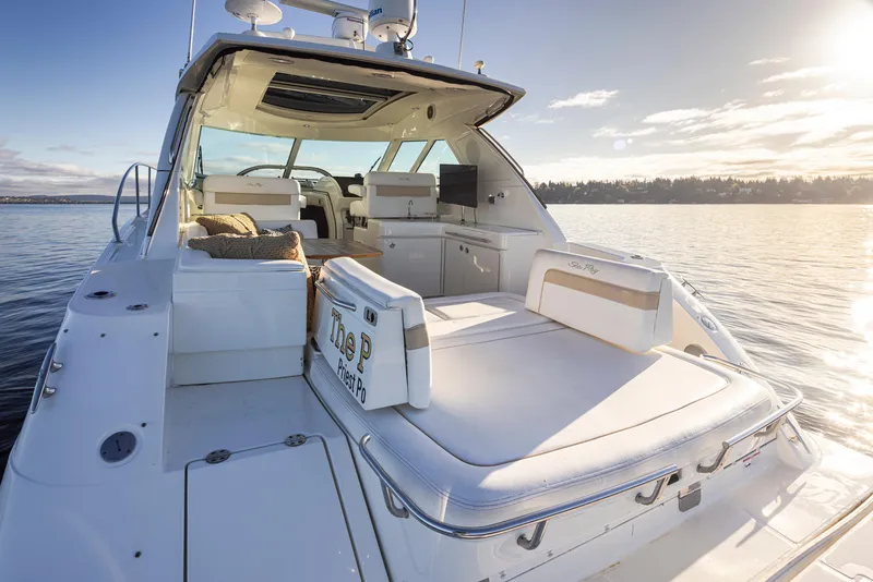 Slide: The Image of 2010 Sea Ray Sundancer yacht on calm water at sunset. - 6