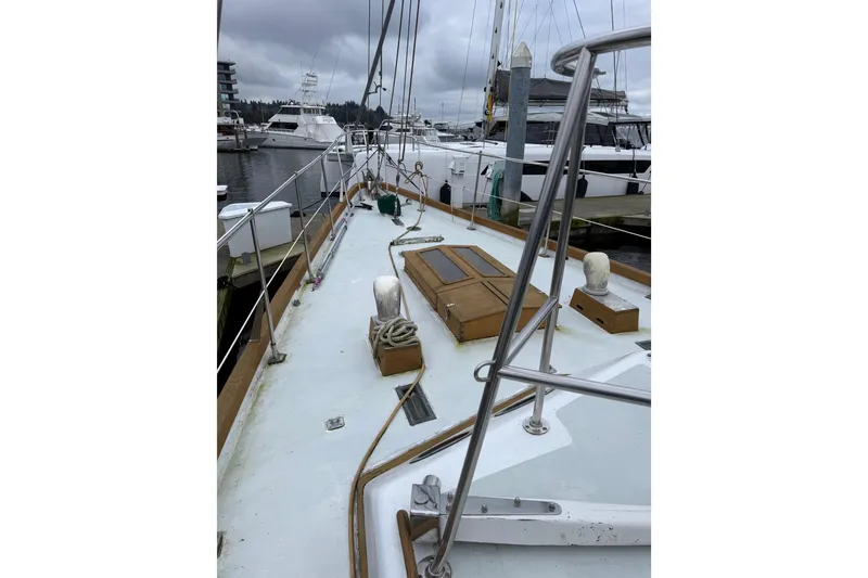 Slide: The Image of Sailboat deck view at marina, HMMD 46 model, 1990, overcast sky. - 8