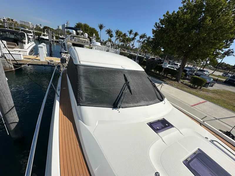Slide: The Image of 2018 Bavaria S40 Coupe docked at marina, featuring sleek design and sunroof. - 19
