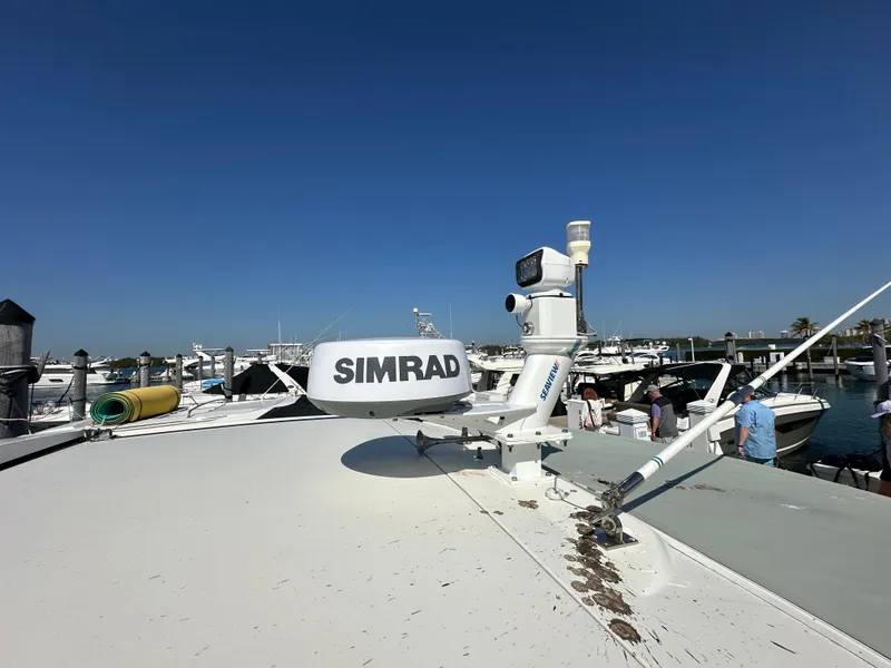 Slide: The Image of 2018 Bavaria S40 Coupe with Simrad equipment at a marina under clear blue skies. - 24