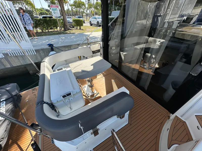 Slide: The Image of 2018 Bavaria S40 Coupe yacht with outdoor seating and wooden deck. - 27