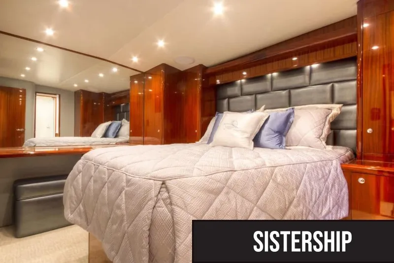 Slide: The Image of Luxurious cabin interior of 2026 Titan Yachts Sportfish, featuring elegant wood finishes and plush bedding. - 5