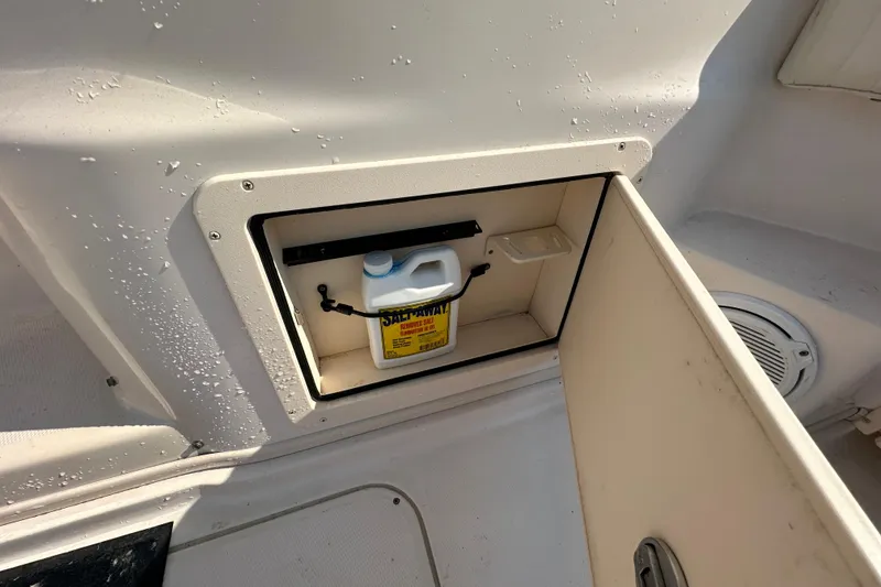 Slide: The Image of Storage compartment on a 2008 Grady White Express boat with cleaning solution. - 12