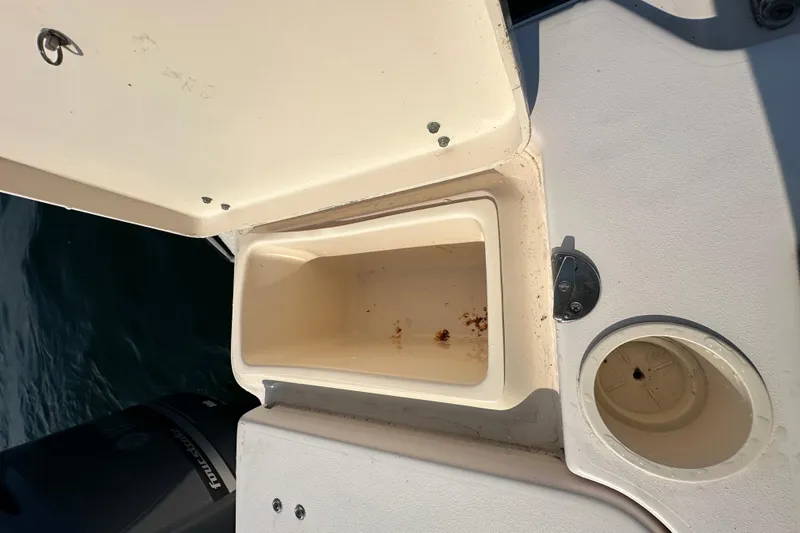 Slide: The Image of Open storage compartment on 2008 Grady White Express boat, showing interior details. - 17
