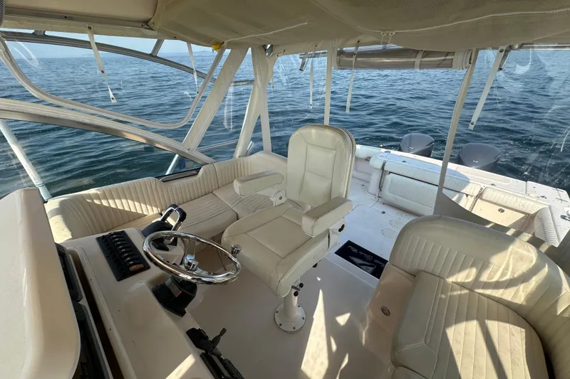 Slide: The Image of 2008 Grady White Express boat interior with helm, seating, and ocean view. - 23