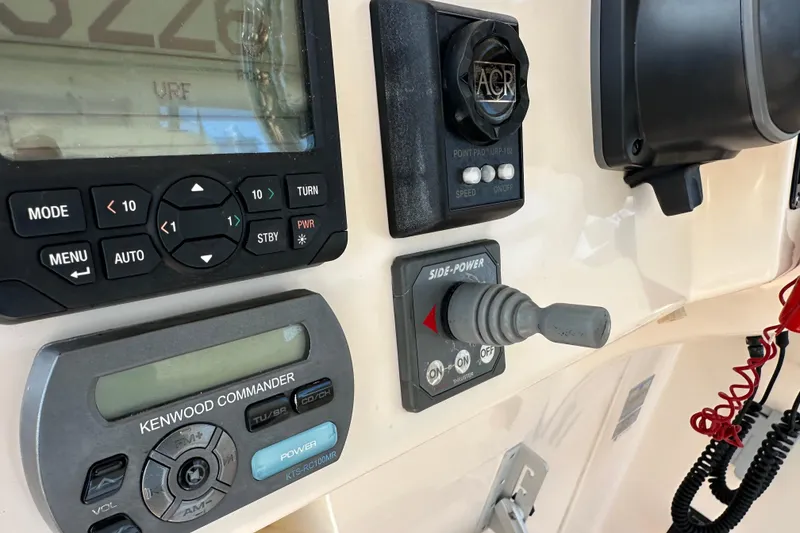 Slide: The Image of Control panel of a 2008 Grady White Express boat with navigation and audio systems. - 26