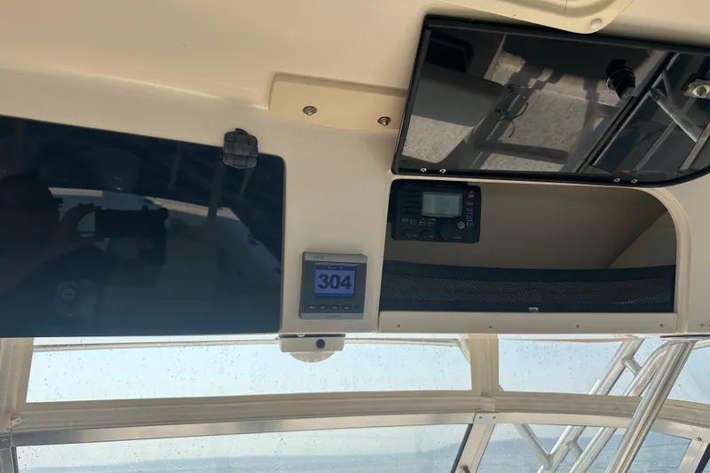 Slide: The Image of Interior view of a 2008 Grady White Express boat dashboard with navigation equipment. - 28