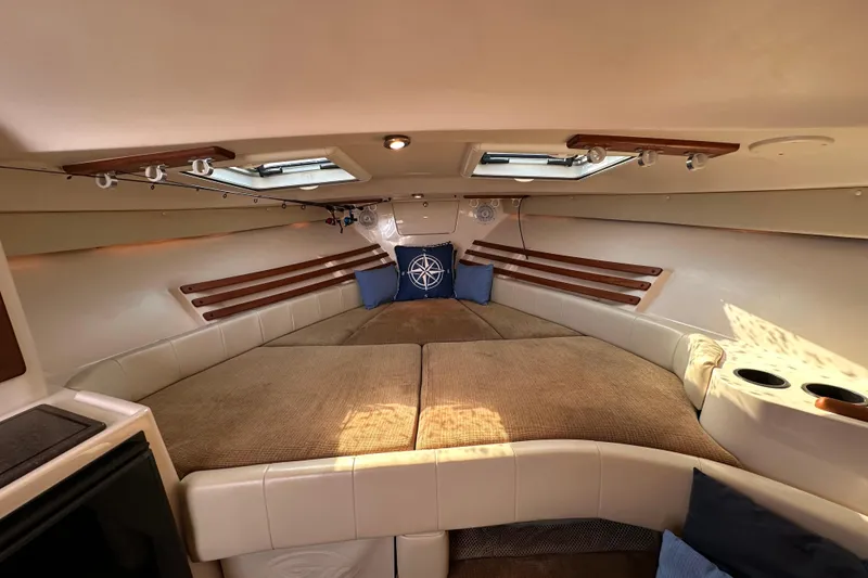 Slide: The Image of 2008 Grady White Express cabin interior with cozy seating and nautical decor. - 37