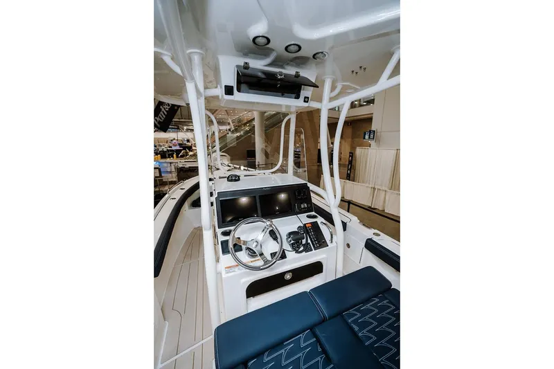 Slide: The Image of Manufacturer Provided Image: 2026 Parker 230 Coastal Elite boat interior with modern helm and seating. - 10