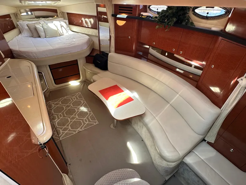 Slide: The Image of Luxurious interior of 2004 Sea Ray 340 Sundancer yacht with elegant seating and bed. - 29