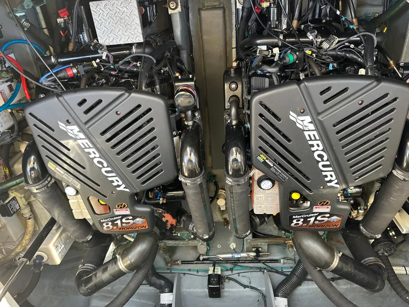 Slide: The Image of Twin Mercury engines in a 2004 Sea Ray 340 Sundancer boat. - 43