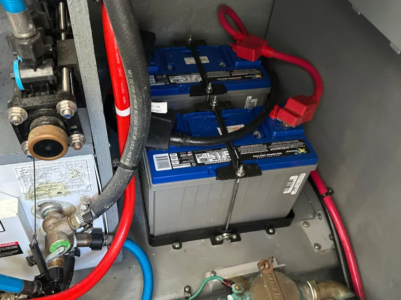Slide: The Image of Batteries and wiring inside a 2004 Sea Ray 340 Sundancer boat. - 46