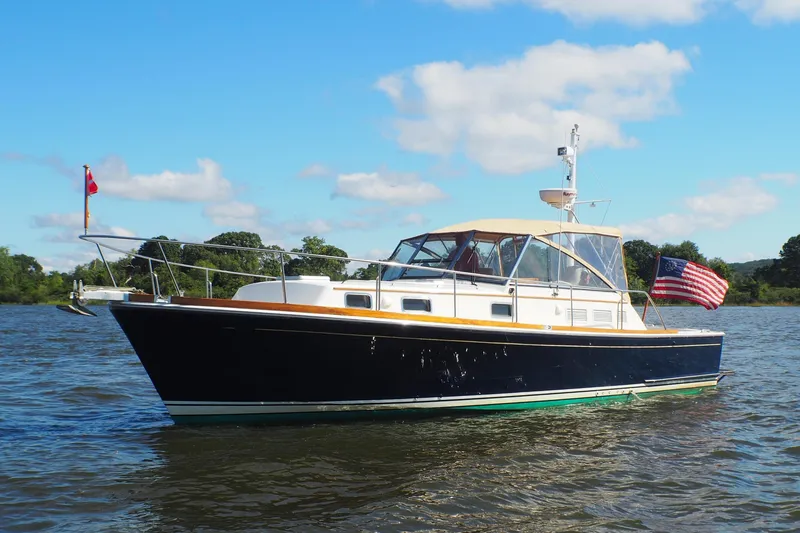 The Image of 1995 Grand Banks 38 Eastbay EX yacht on water, repowered with twin CAT engines. - 0