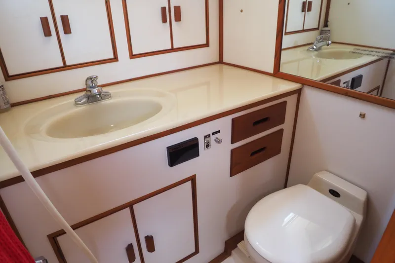 Slide: The Image of Bathroom interior of 1995 Grand Banks 38 Eastbay EX yacht, featuring sink and toilet. - 12