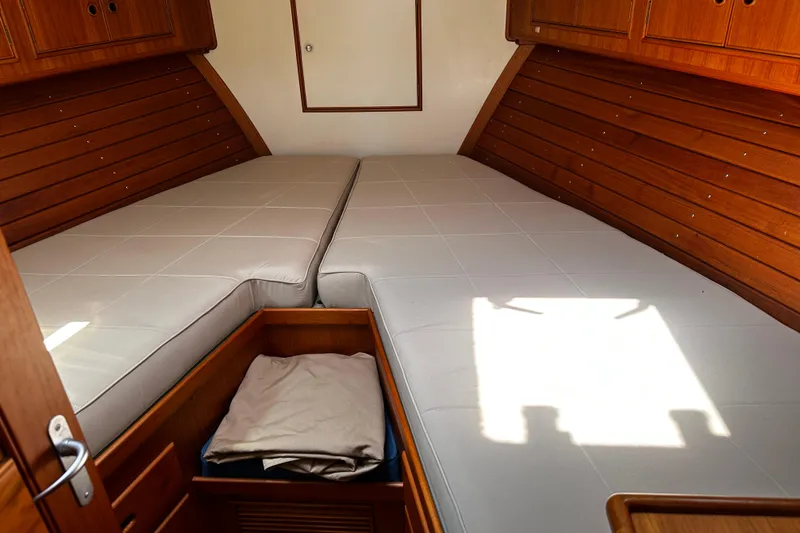 Slide: The Image of Cabin interior of 1995 Grand Banks 38 Eastbay EX with twin beds and wooden cabinetry. - 17