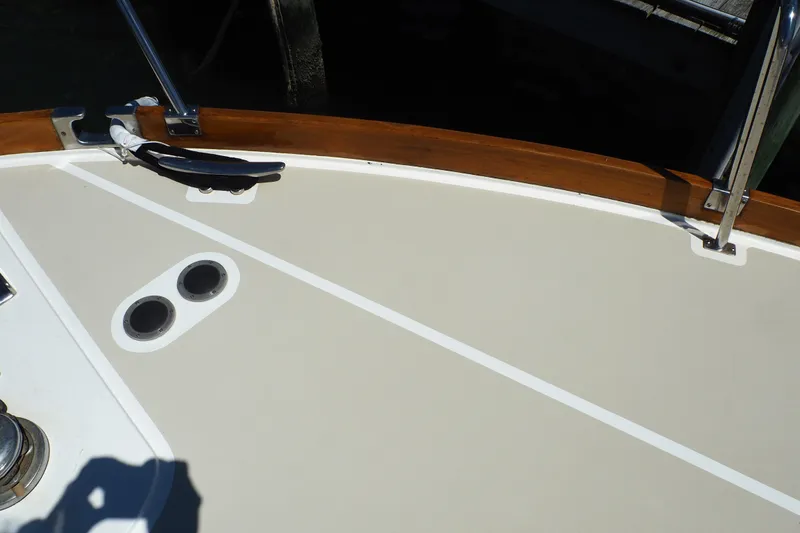 Slide: The Image of Deck of 1995 Grand Banks 38 Eastbay EX with cleat and railing. - 21