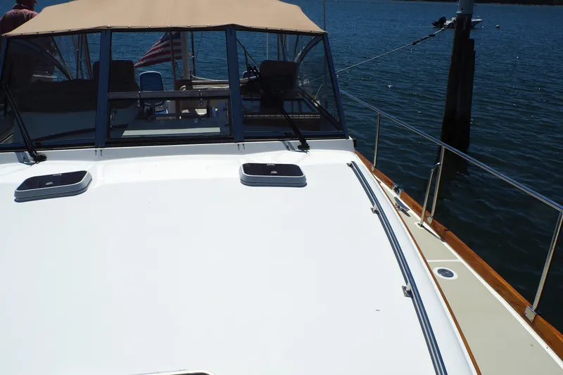 Slide: The Image of 1995 Grand Banks 38 Eastbay EX yacht deck with water view. - 23