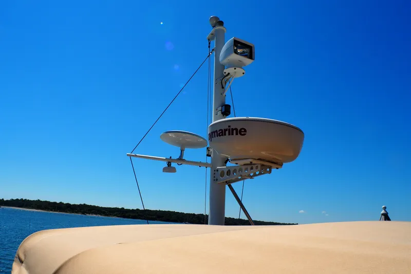 Slide: The Image of Radar equipment on 1995 Grand Banks 38 Eastbay EX against clear blue sky. - 25