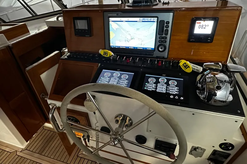 Slide: The Image of Helm of 1995 Grand Banks 38 Eastbay EX with navigation and control systems. - 27