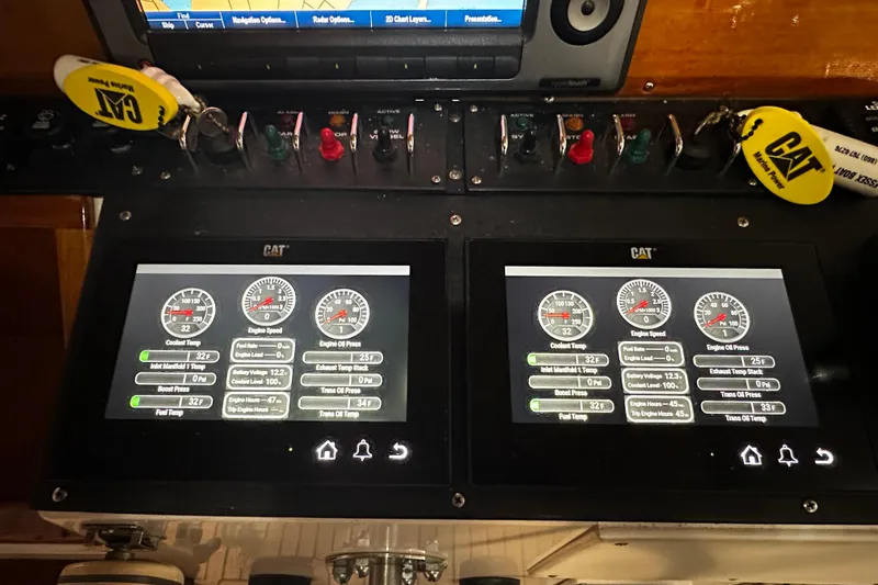 Slide: The Image of Control panel of a 1995 Grand Banks 38 Eastbay EX with CAT engine displays. - 28