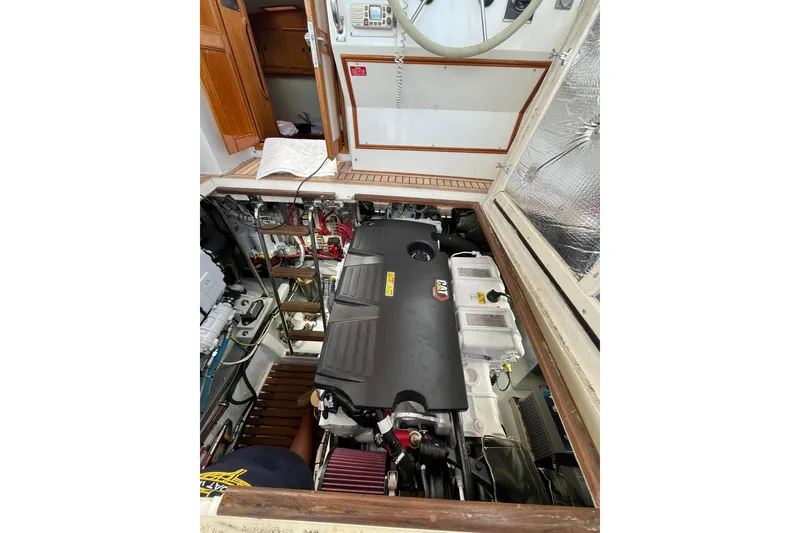Slide: The Image of Engine compartment of 1995 Grand Banks 38 Eastbay EX yacht, showcasing detailed machinery. - 3