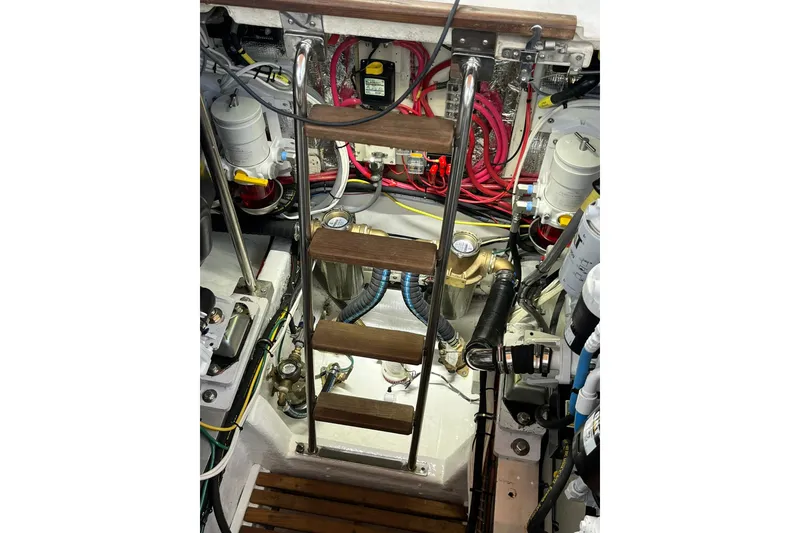 Slide: The Image of Engine room of 1995 Grand Banks 38 Eastbay EX with ladder and mechanical components. - 30