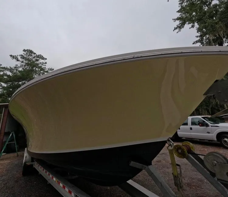 Slide: The Image of 2013 Regulator 34 Center Console boat on trailer, side view. - 12