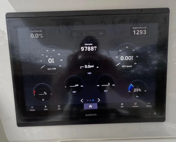 Slide: The Image of Garmin display showing engine metrics on 2013 Regulator 34 Center Console boat. - 31
