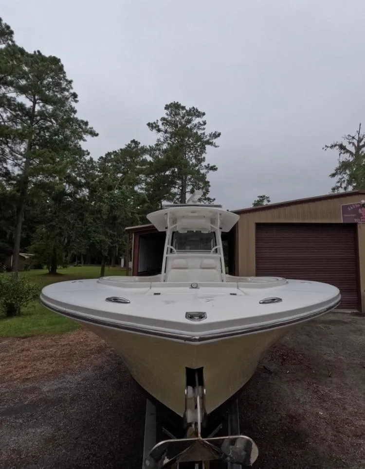Slide: The Image of 2013 Regulator 34 Center Console boat in outdoor setting, front view. - 5