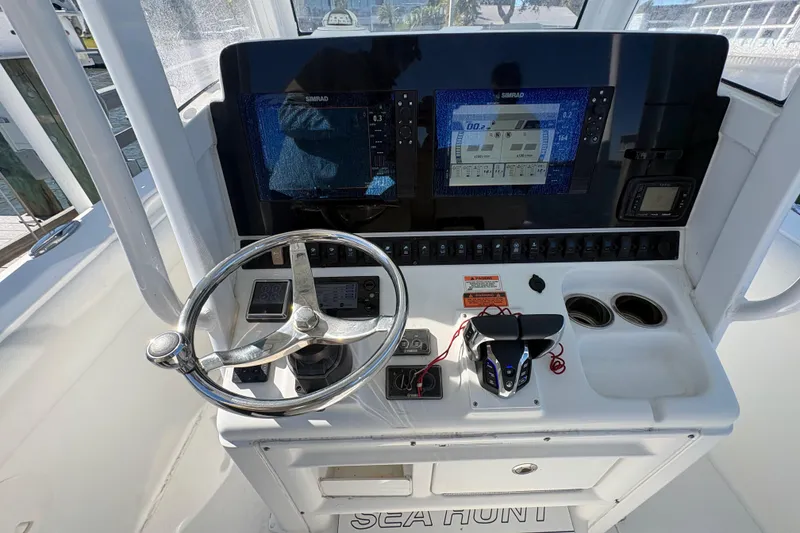 Slide: The Image of 2018 Sea Hunt Gamefish 30 boat storage compartment with ropes and gear. - 10
