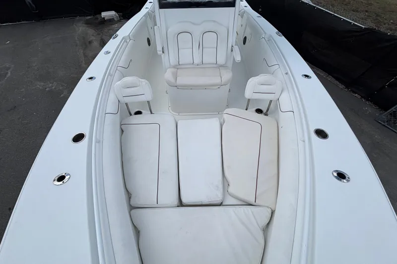 Slide: The Image of 2018 Sea Hunt Gamefish 30 Forward Seating with white cushioned seats and spacious layout. - 102