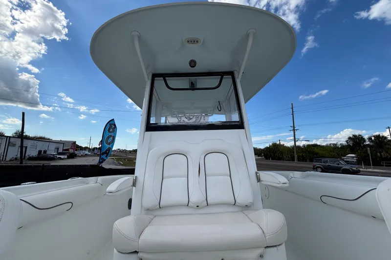 Slide: The Image of 2018 Sea Hunt Gamefish 30 Forward Seating boat under clear blue sky. - 110