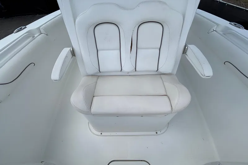 Slide: The Image of 2018 Sea Hunt Gamefish 30 Forward Seating, white cushioned boat seat with armrests. - 111